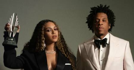 Jay-Z and Beyonce with their awards